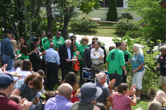 Bernie, waiting to speak, studies his notes.