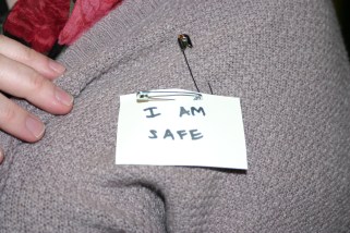 Participant showing her "I am safe" designating her as a safe person to go to if someone feels uncomfortable or harassed.